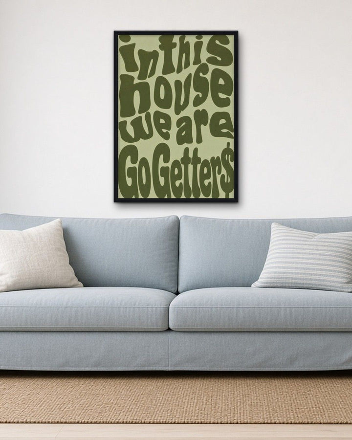 IN THIS HOUSE WE ARE GO GETTERS framed on a wall